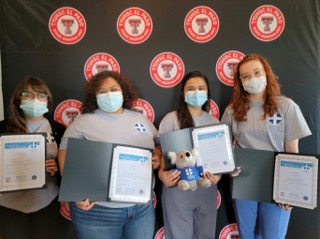MHFA students holding certificates.