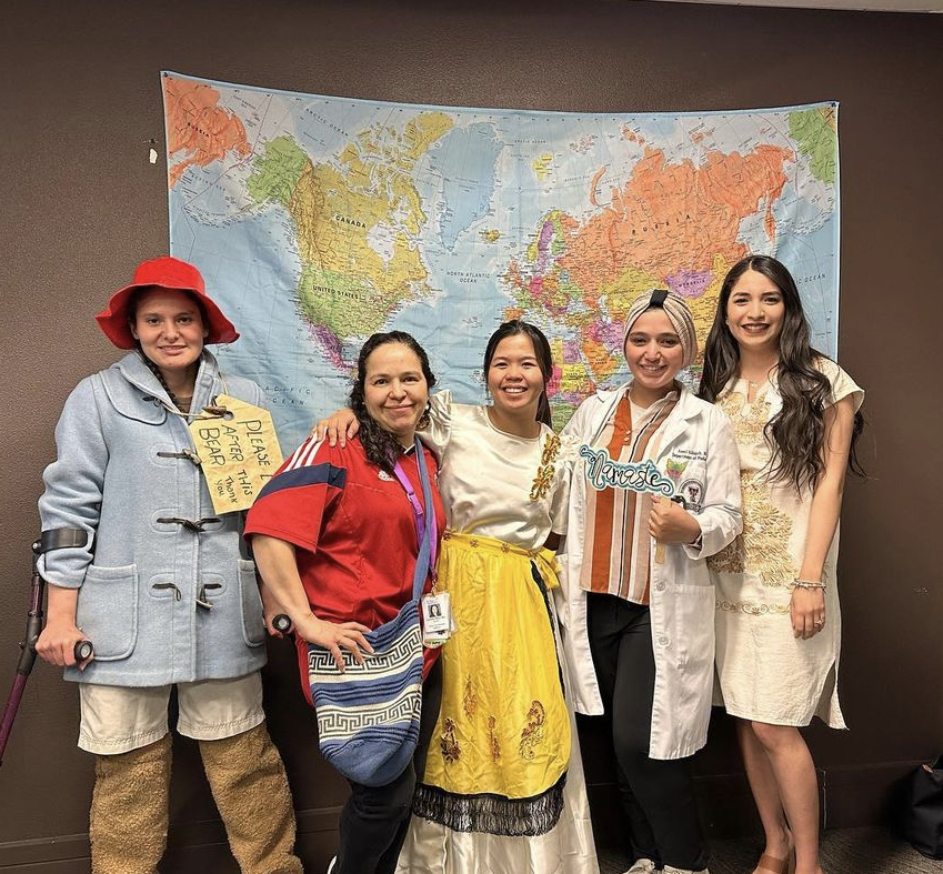 International residents dressed in clothing representative of their cultures.